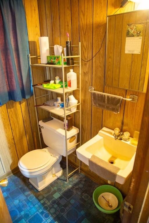 320 Brobston St, Baxley, GA 31513 - bathroom featuring wood walls and toilet