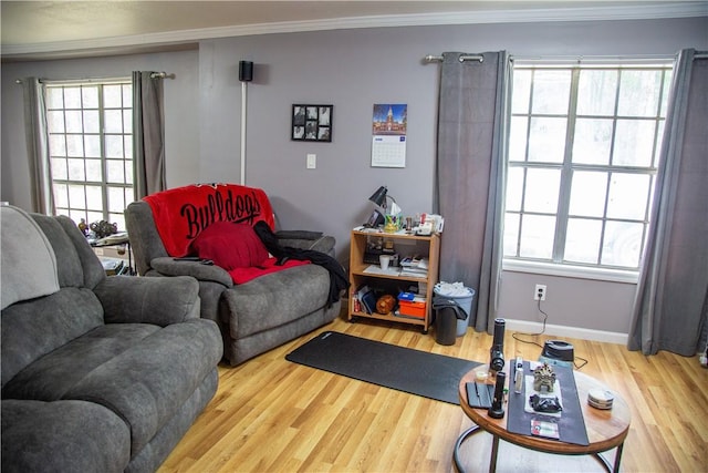320 Brobston St, Baxley, GA 31513 - living room with wood finished floors, crown molding, and plenty of natural light