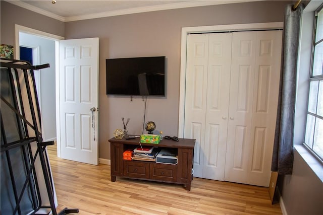 320 Brobston St, Baxley, GA 31513 - bedroom featuring light wood-style floors, ornamental molding, and a closet