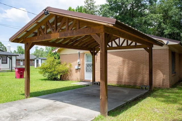 320 Brobston St, Baxley, GA 31513 - view of patio featuring a carport