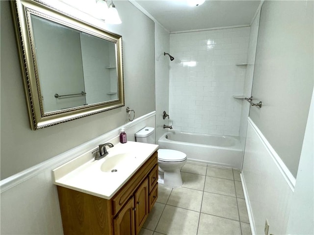 full bathroom with toilet, vanity, tile patterned floors, tiled shower / bath combo, and crown molding