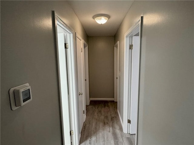 hallway with light wood-type flooring
