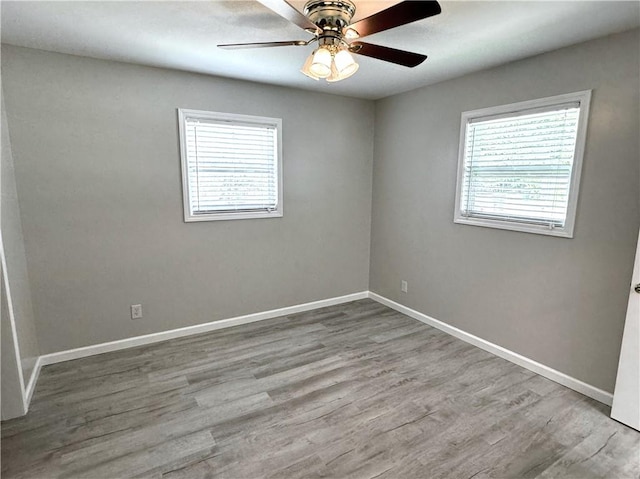 spare room featuring ceiling fan and light hardwood / wood-style floors