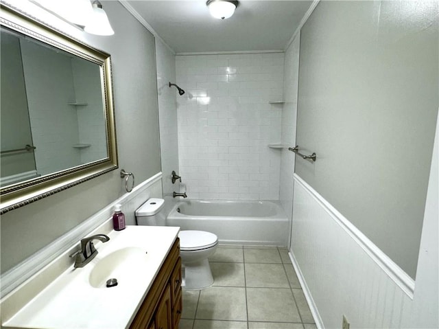 full bathroom featuring toilet, vanity, tiled shower / bath, tile patterned floors, and ornamental molding