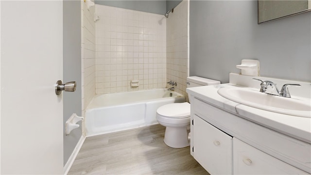 1301 Riverside Ave, Waycross, GA 31501 - bathroom featuring toilet, vanity, wood finished floors, and shower / tub combination