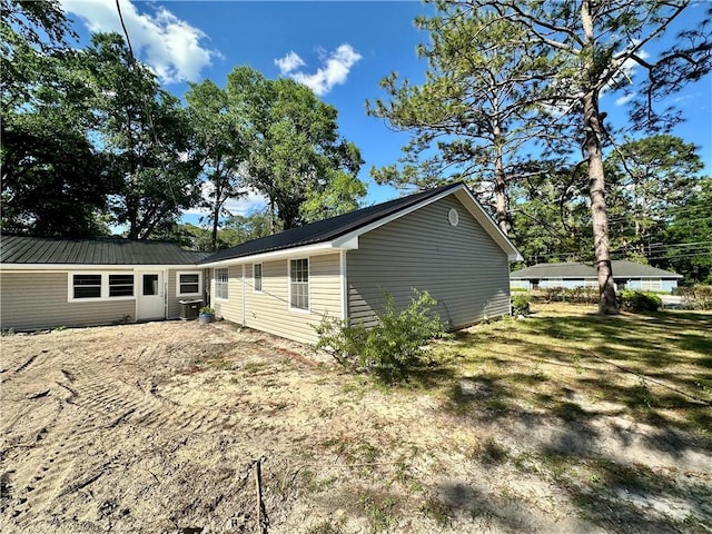 1301 Riverside Ave, Waycross, GA 31501 - view of property exterior with metal roof