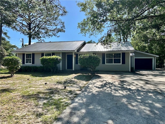 1301 Riverside Ave, Waycross, GA 31501 - ranch-style house with concrete driveway, a garage, and metal roof