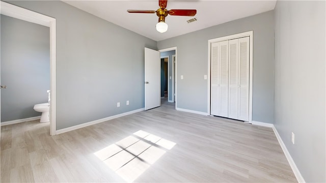 1301 Riverside Ave, Waycross, GA 31501 - unfurnished bedroom featuring light wood-style flooring, a closet, and baseboards