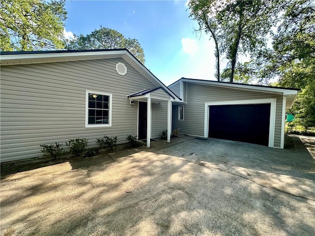 1301 Riverside Ave, Waycross, GA 31501 - view of front of property with concrete driveway, an outbuilding, and an attached garage