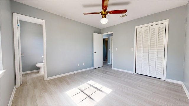 1301 Riverside Ave, Waycross, GA 31501 - unfurnished bedroom featuring light wood-style flooring, a closet, baseboards, and ceiling fan
