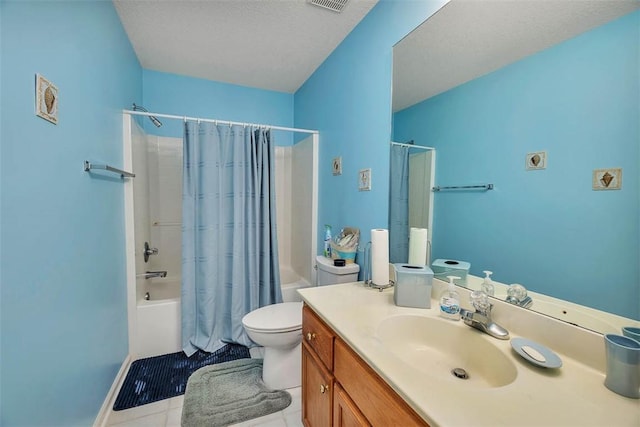 full bathroom featuring tile patterned flooring, vanity, shower / tub combo, toilet, and a textured ceiling