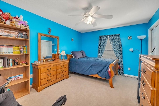 carpeted bedroom with ceiling fan