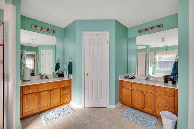 bathroom with vanity and tile patterned flooring