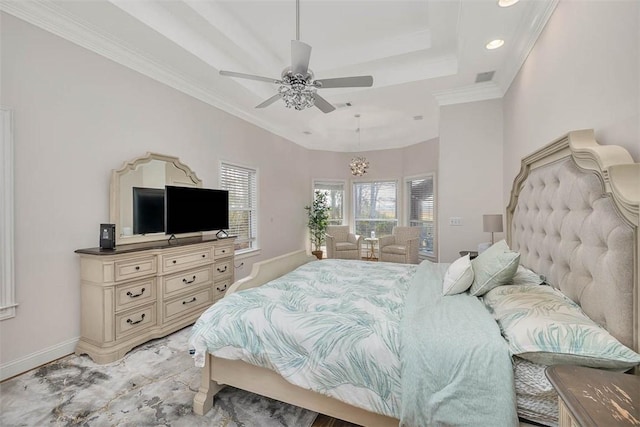 bedroom with a raised ceiling, crown molding, and ceiling fan