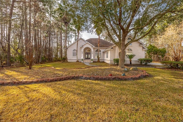 view of front of home with a front lawn