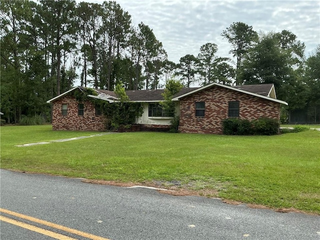 2608 Winchester Dr, Waycross, GA 31501 - ranch-style house with a front yard and brick siding