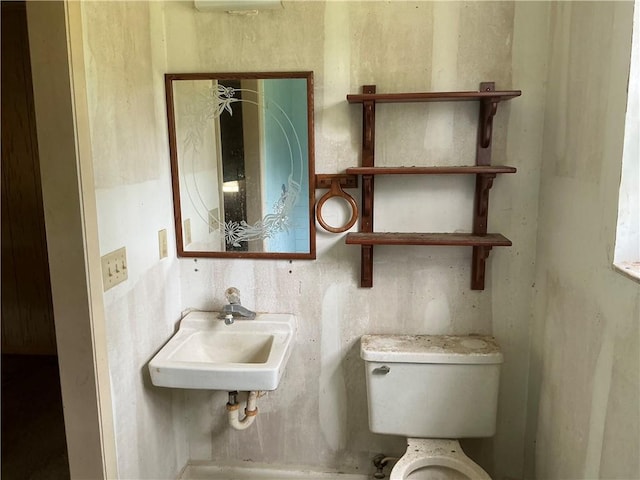 2608 Winchester Dr, Waycross, GA 31501 - half bathroom with a sink and toilet