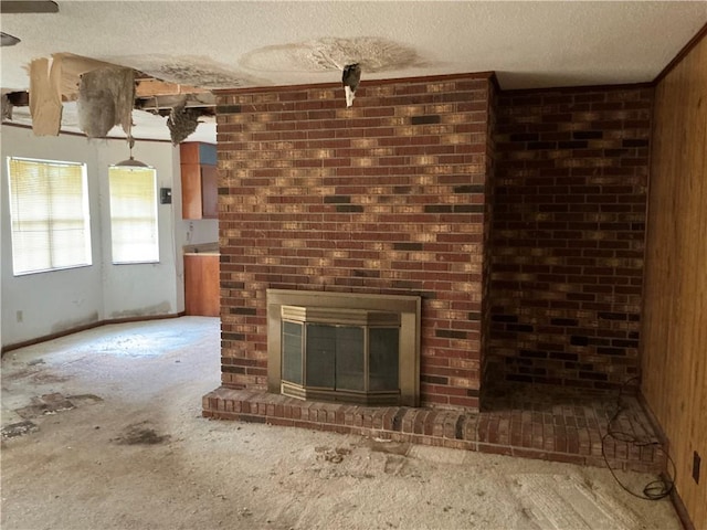2608 Winchester Dr, Waycross, GA 31501 - unfurnished living room featuring a textured ceiling, a brick fireplace, and carpet