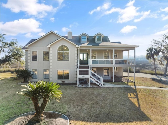 view of front of property featuring a porch and a front lawn