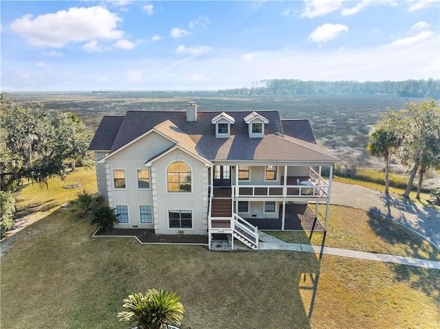 view of front of home featuring a front yard