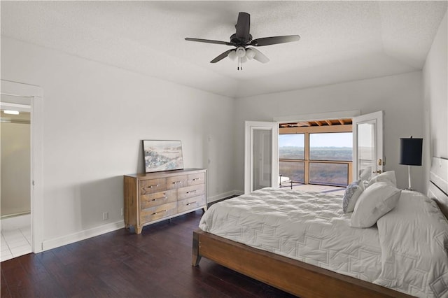 bedroom featuring a textured ceiling, dark hardwood / wood-style flooring, and ceiling fan