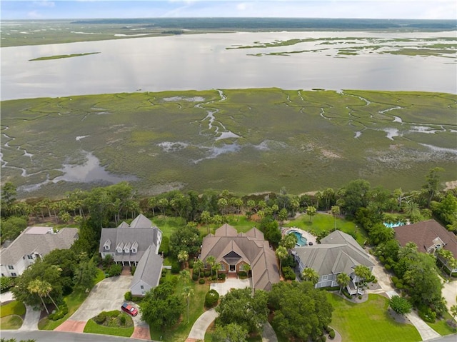 birds eye view of property with a residential view and a water view