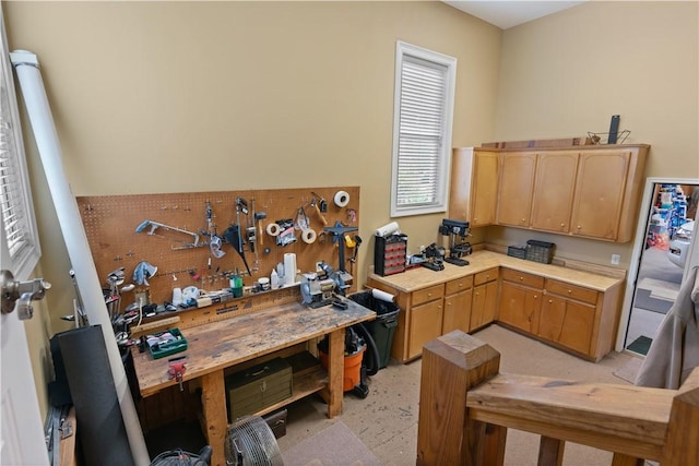 kitchen featuring light countertops and light brown cabinets