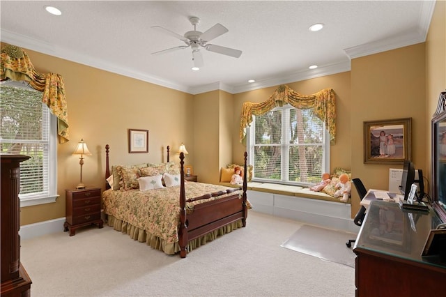 carpeted bedroom featuring baseboards, ceiling fan, recessed lighting, and crown molding