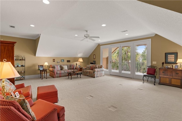 living room featuring recessed lighting, visible vents, vaulted ceiling, and light colored carpet