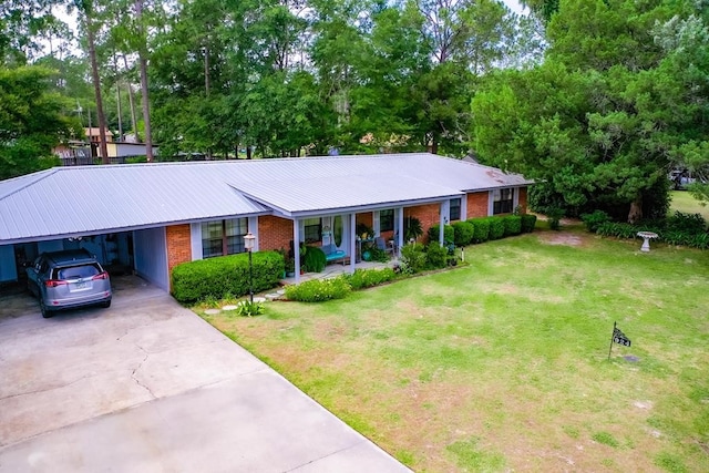 ranch-style home with a front yard and a carport