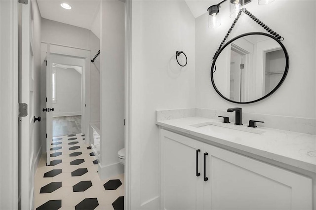 bathroom with vanity and toilet