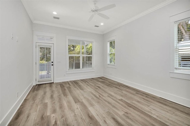 spare room with crown molding, ceiling fan, and light wood-type flooring