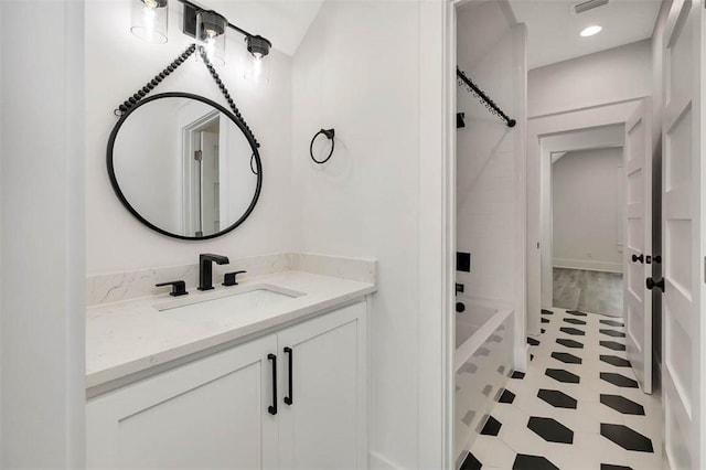 bathroom with bathing tub / shower combination and vanity