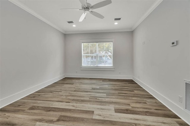 unfurnished room featuring hardwood / wood-style flooring, ceiling fan, and crown molding