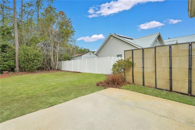 view of yard featuring a patio and fence