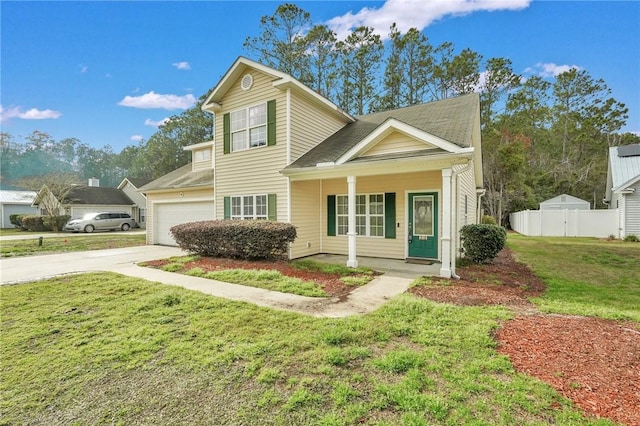 traditional-style house featuring driveway, fence, a porch, and a front yard