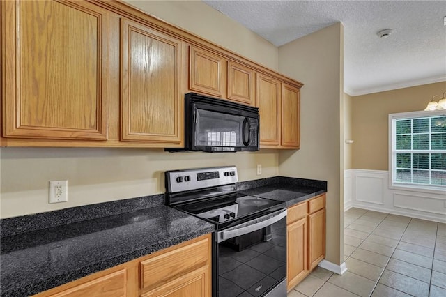 kitchen featuring dark countertops, stainless steel range with electric stovetop, black microwave, and a textured ceiling