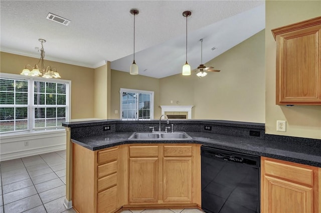 kitchen with a sink, visible vents, dishwasher, and hanging light fixtures