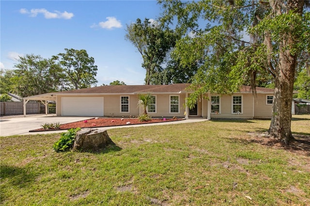 ranch-style home featuring fence, an attached garage, driveway, a carport, and a front yard