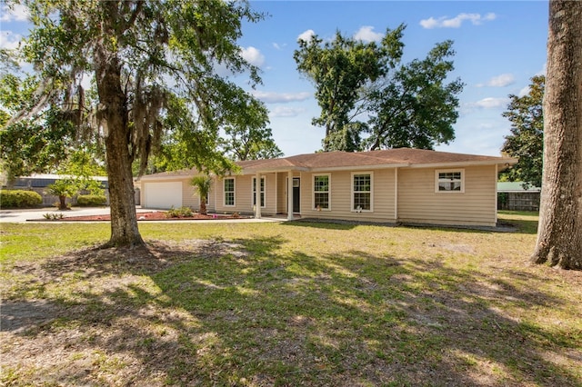 single story home with a garage, a front lawn, and fence