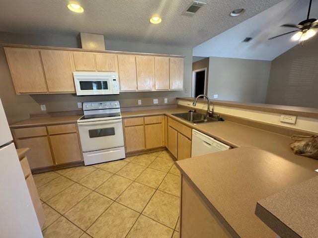 kitchen featuring kitchen peninsula, light brown cabinetry, white appliances, a textured ceiling, and sink