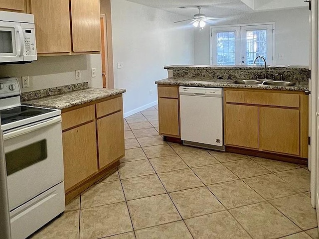 kitchen with white appliances, sink, ceiling fan, light brown cabinetry, and light tile patterned flooring