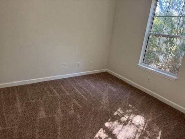 unfurnished room featuring carpet flooring