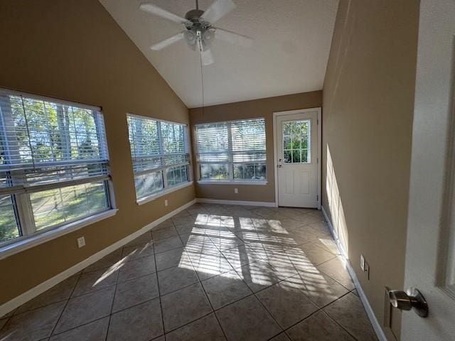 unfurnished sunroom with ceiling fan and lofted ceiling