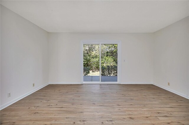 empty room featuring a textured ceiling, ceiling fan, and dark hardwood / wood-style floors