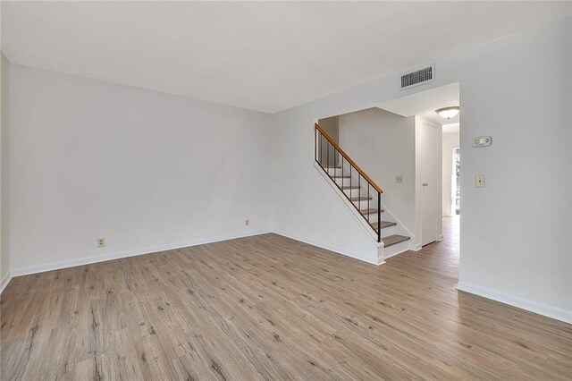 stairs featuring hardwood / wood-style flooring