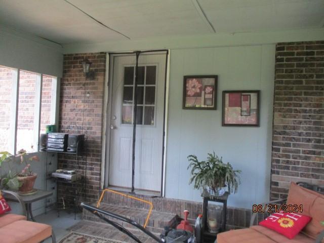 entrance to property with covered porch