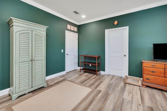 interior space with visible vents, crown molding, baseboards, recessed lighting, and wood finished floors