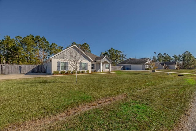 ranch-style house with a front yard and fence