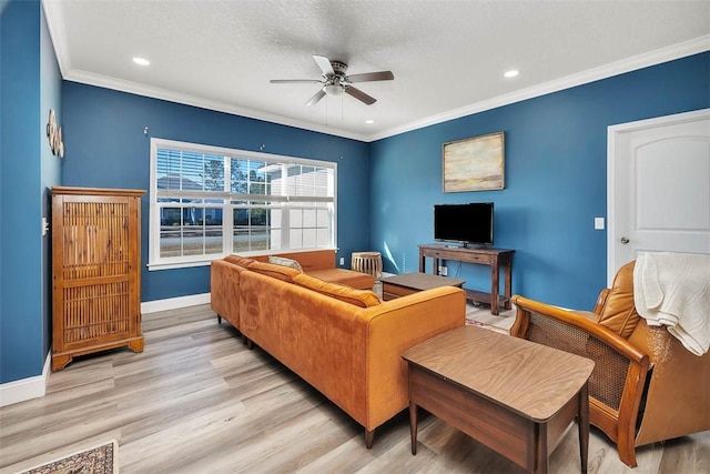 living room with a ceiling fan, baseboards, light wood finished floors, recessed lighting, and ornamental molding